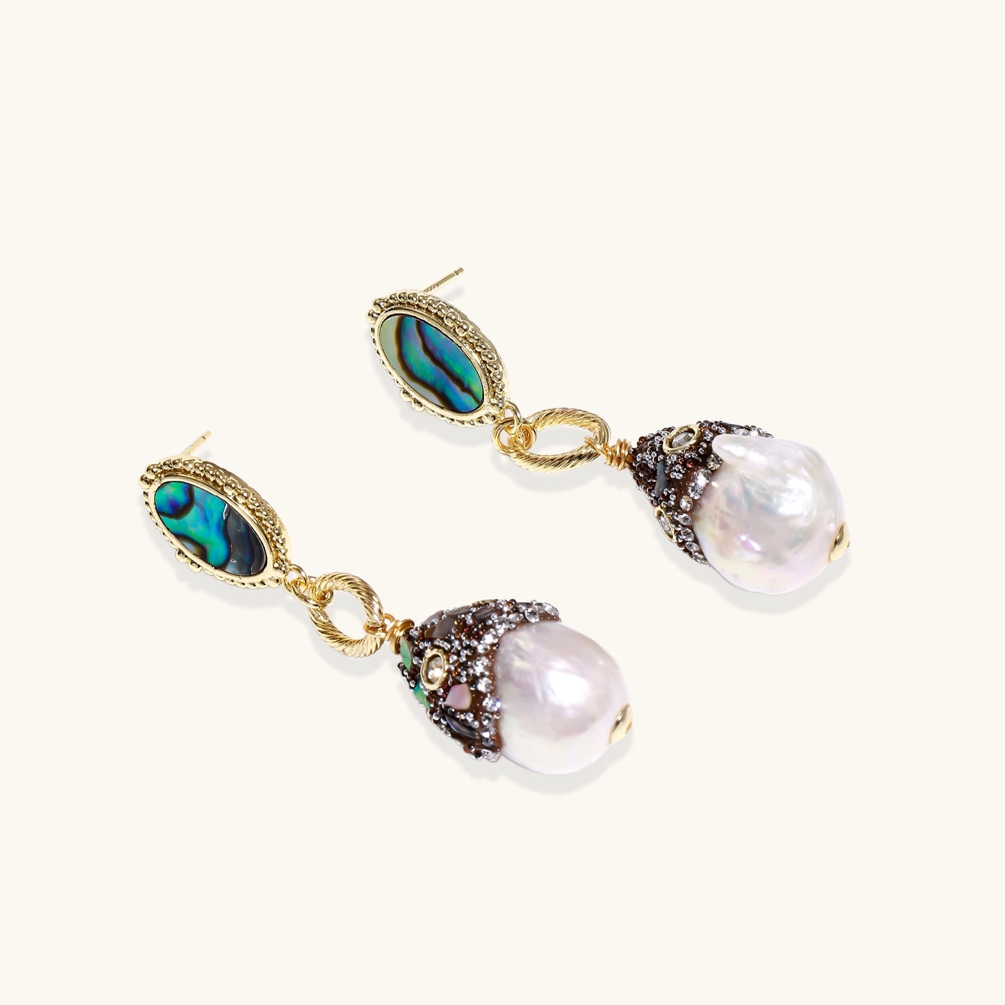 Gold-plated statement earrings with iridescent abalone shells, rope chain links, and crystal-capped baroque pearls