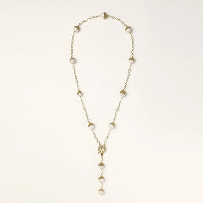 Long gold-plated lariat necklace featuring baroque pearls with metal caps arranged in elegant Y-shape design