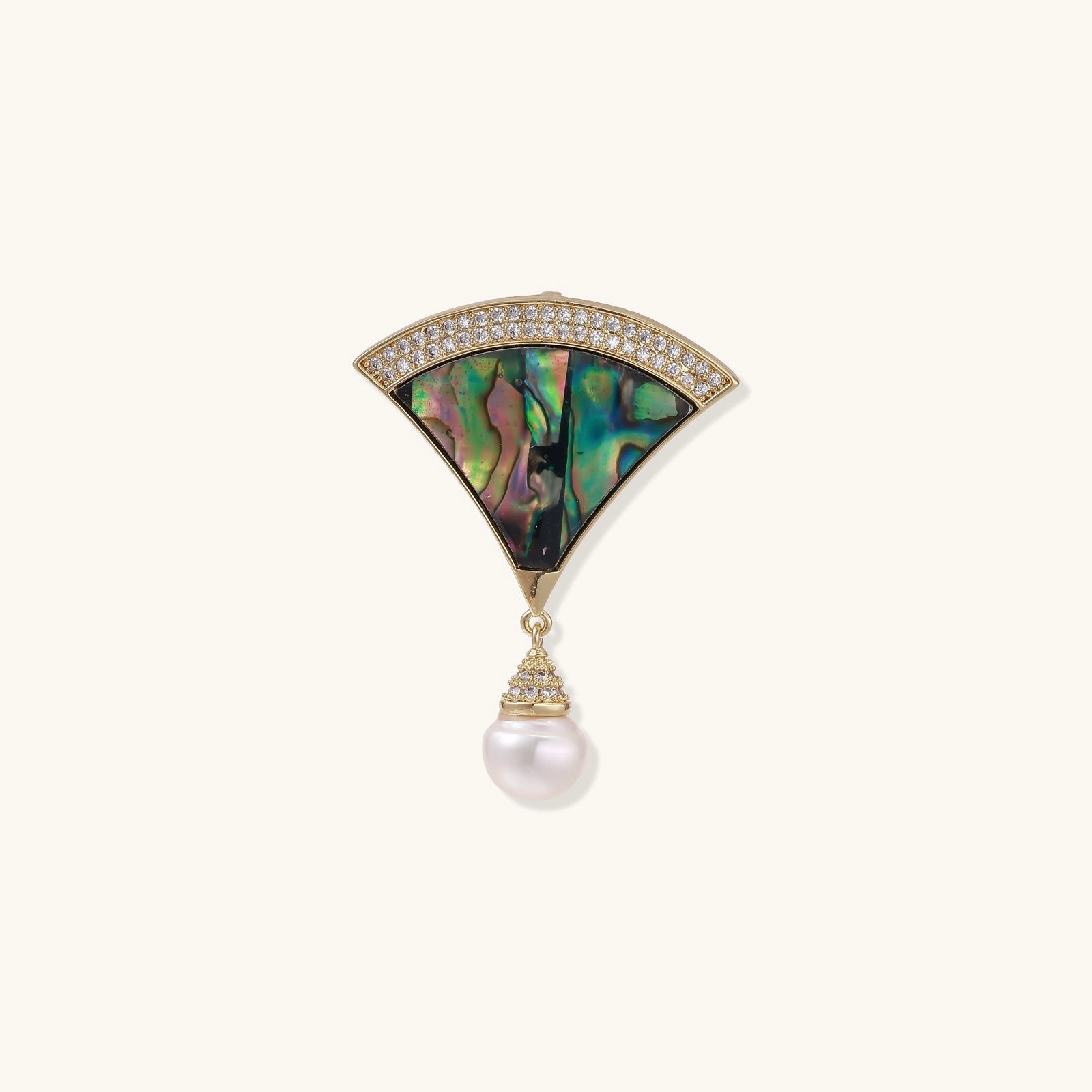 Art Deco fan-shaped pin with iridescent abalone shell, gold setting with crystals, and freshwater pearl drop.
