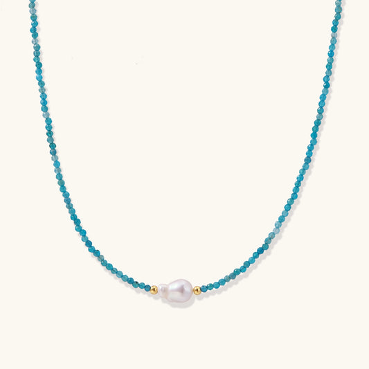 Delicate necklace featuring small turquoise apatite beads with a central freshwater pearl on sterling silver chain