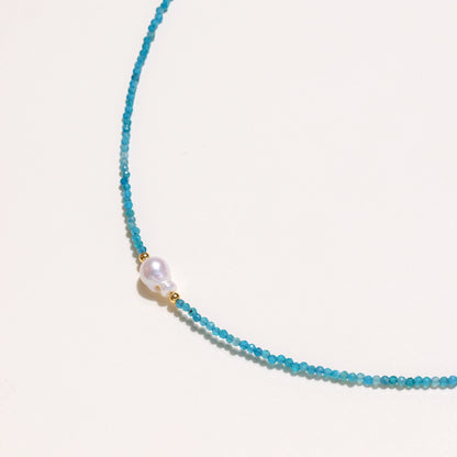 Delicate necklace featuring small turquoise apatite beads with a central freshwater pearl on sterling silver chain