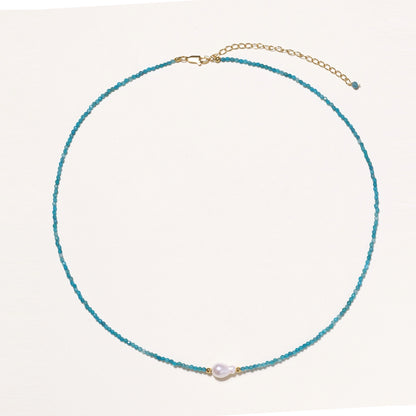 Delicate necklace featuring small turquoise apatite beads with a central freshwater pearl on sterling silver chain