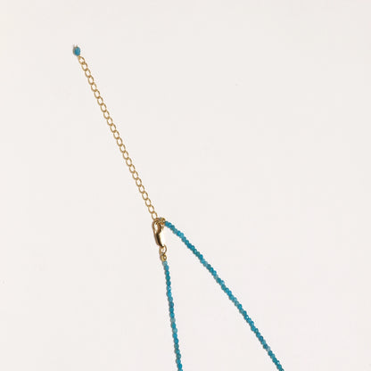 Delicate necklace featuring small turquoise apatite beads with a central freshwater pearl on sterling silver chain
