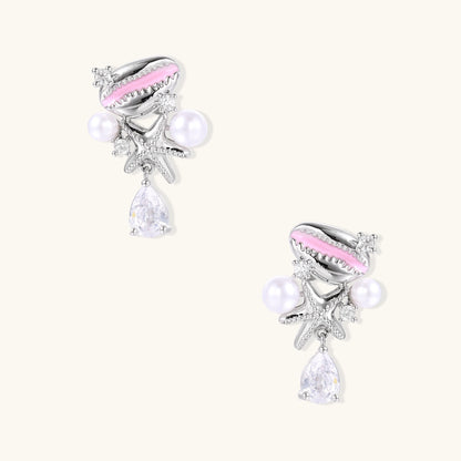 Gold-plated dangle earrings with enamel shell charms, white pearls, starfish accents, and crystal drops on white background.