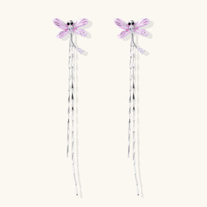 Long dangle earrings with purple dragonfly charms and crystal chains on white background, gold-plated finish.