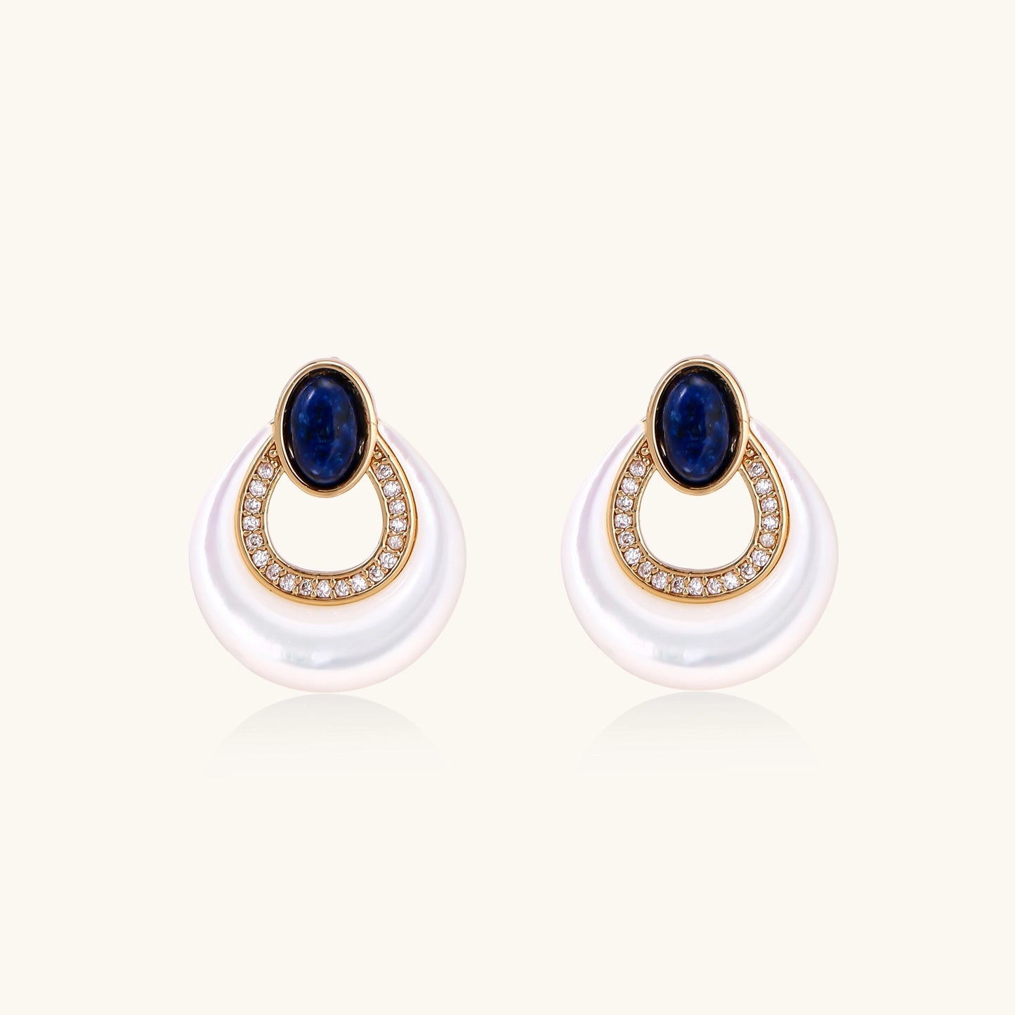 Gold-plated drop earrings featuring blue lapis lazuli ovals, diamond-studded circles, and iridescent mother of pearl teardrops