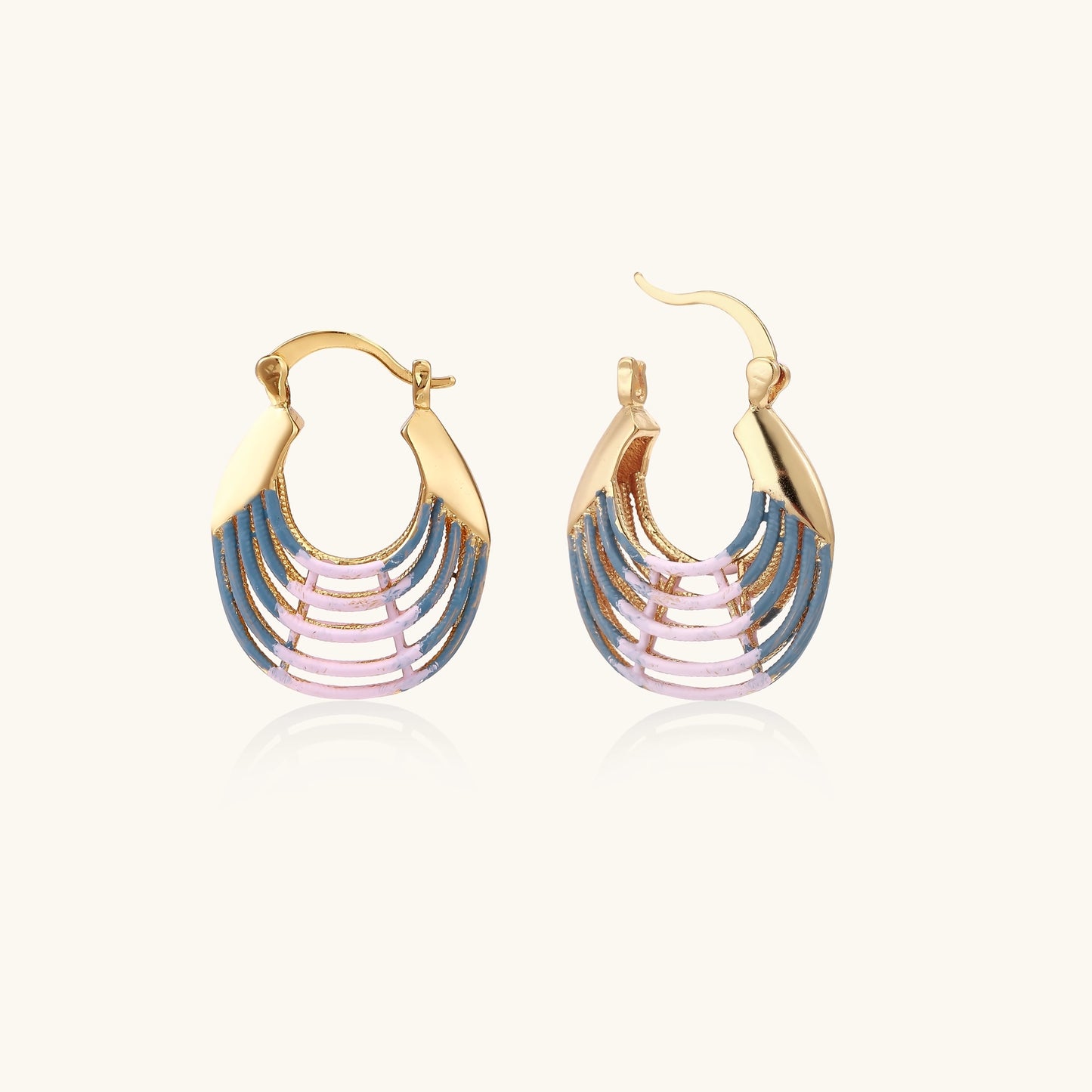Gold hoop earrings with layered blue to pink enamel in shell pattern, photographed against white background