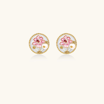 Round gold-plated stud earrings featuring pink enamel roses with freshwater pearl accents on white background.