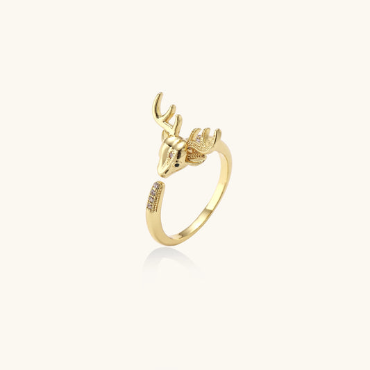 Gold-plated brass deer antler ring with cubic zirconia stones featuring detailed stag head design on white background.