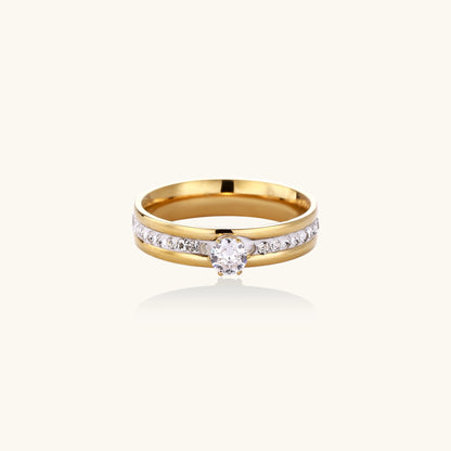 14K gold plated ring with center rhinestone and accent stones along the band on white background.