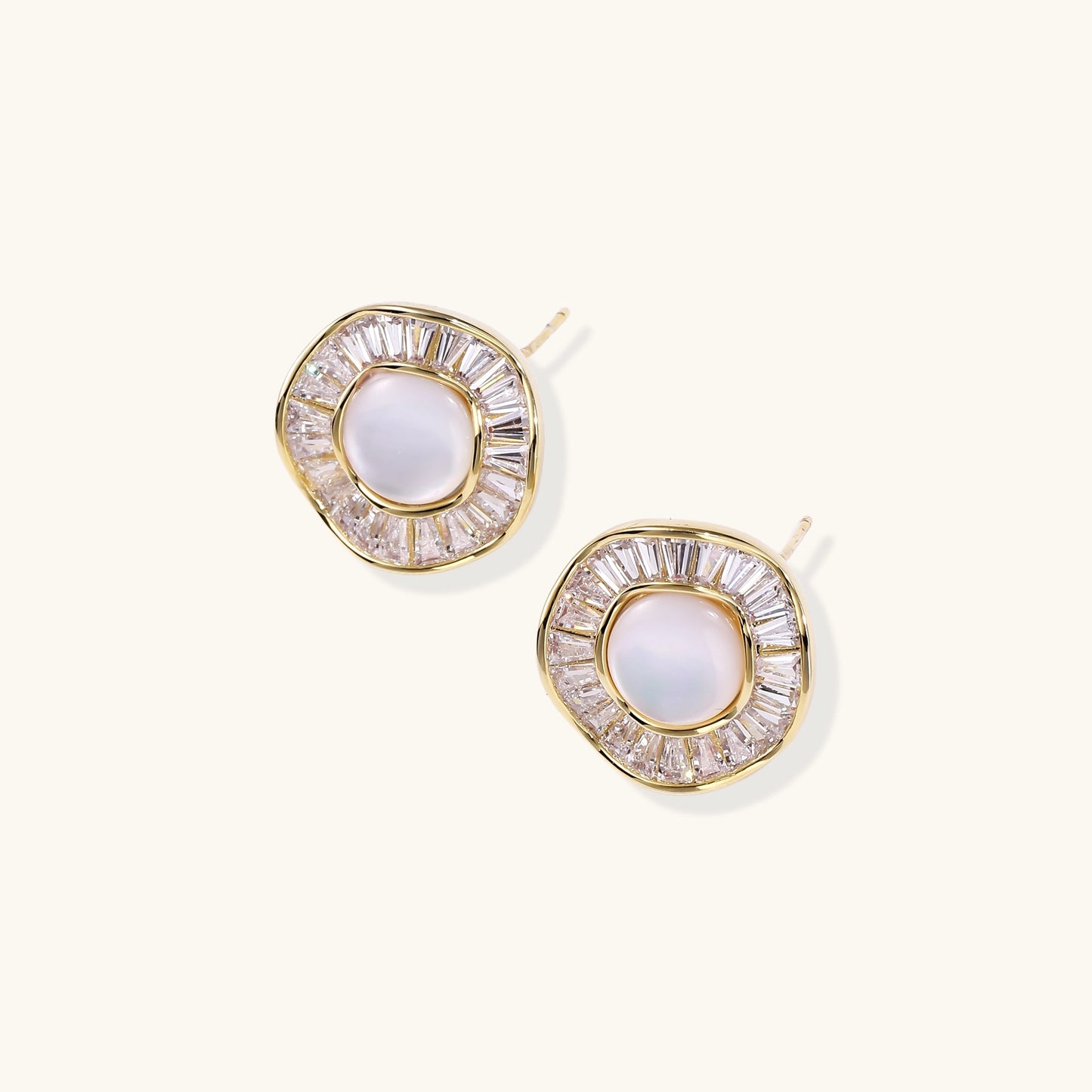 Gold-plated stud earrings with central freshwater pearl surrounded by baguette crystals in radial pattern