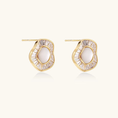 Gold-plated stud earrings with central freshwater pearl surrounded by baguette crystals in radial pattern