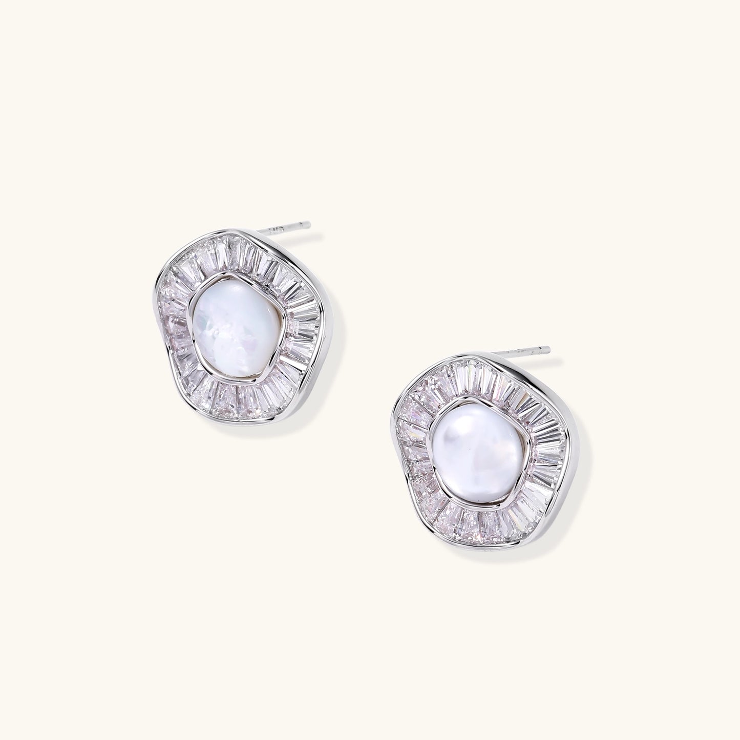 Gold-plated stud earrings with central freshwater pearl surrounded by baguette crystals in radial pattern