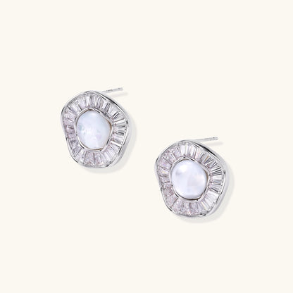 Gold-plated stud earrings with central freshwater pearl surrounded by baguette crystals in radial pattern