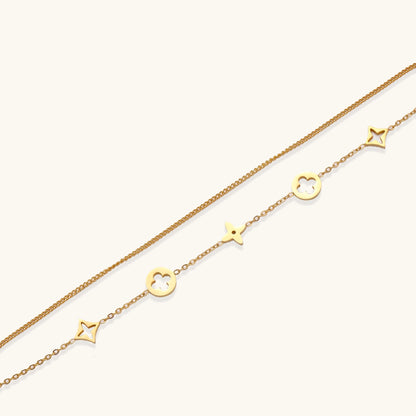 Dainty gold-plated bracelet with star and clover charms on double chain with adjustable extender